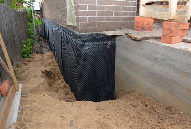 Happy homeowners after waterproofing job in Spring Lake